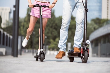 people riding electric scooters